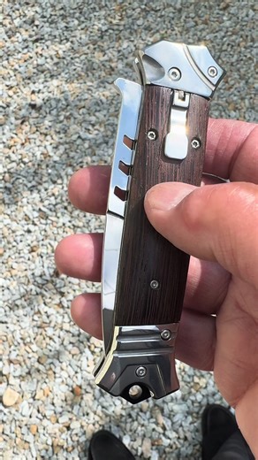 This #FoldingKnife is actually a hidden #Switchblade with a stunning #MirrorPolished blade and #WoodenHandle making it the perfect #CollectorsKnife for #EverydayCarry enthusiasts