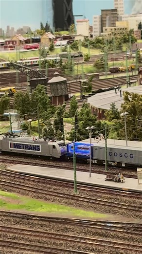 HHLA on Instagram: "On rail across Europe – mini version ✨ @miniaturwunderland, one of Hamburg’s most visited attractions and a landmark of the Speicherstadt, has welcomed a special little traveler since the start of the year: a blue HHLA container. It journeys through the detailed miniature railway landscapes, crossing multiple European countries, and symbolising our cross-border logistics network. Measuring just 70 × 28 × 29 mm, the container is hauled by a mini METRANS locomotive, showcasing 