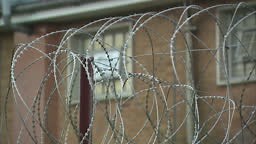 Exterior shots of HMP Onley Prison in Rugby with razor wire and...
