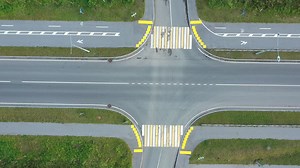 Aerial View of a Road Intersection with Bike Lanes and Crosswalks | Free Stock Video Footage