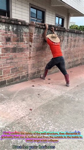 The process of manually demolishing a wall