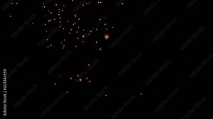 4K Many asian fire lanterns launching during buddhist festival in chinese new year in Taipei. Rice paper hot air balloons floating in traditional flying sky lantern celebration from Pingxi. Taiwan-Dan
