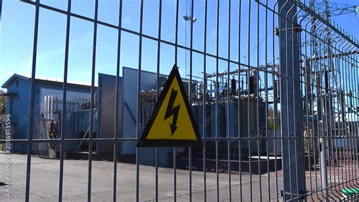 High Voltage Danger Sign on an Electrical Substation Fence