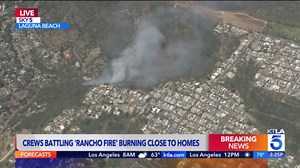 Firefighters race to protect homes from Laguna Beach brush fire