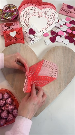 ❤️✂️💌 Save this to create the cutest little lace envelopes for Valentine’s Day using heart doilies! 👉 https://liketk.it/529QY ✨ With just a few simple folds, you can make these delicate pouches perfect for holding little treats. 🍬🥰 Seal them closed with a heart-shaped foam sticker ❤️ for an extra special touch! This DIY is super easy and makes adorable gifts for classmates, friends, or party favors. Spread the love with these charming handmade goodies! ❤️💖💕 #ValentinesDayDIY #HeartDoilies 