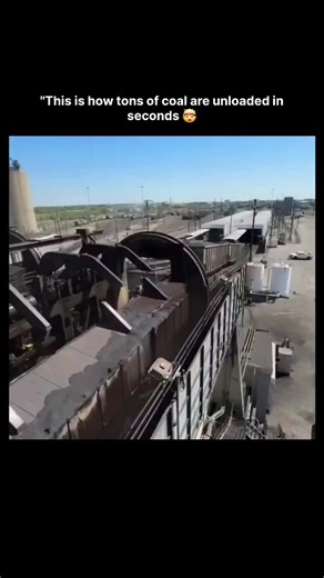 𝙒𝙊𝙍𝙇𝘿 𝙒𝙄𝘿𝙀 on Instagram: "The video depicts the operation of a rotary railcar dumper (also known as a wagon tippler) at an industrial coal handling facility, likely a port or power plant unloading terminal. It shows a loaded open-top railcar positioned within the curved rotary mechanism, where clamps secure the car and rotate it approximately 160-180 degrees, rapidly dumping tons of coal into a below-ground hopper while the car remains coupled to the train. Specific details on the uploa
