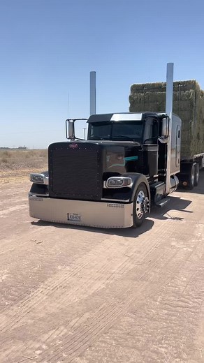 Impressive Black Semi-Truck Hauling Hay Bales