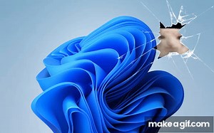 Cat eating a chips through the windows 11 wallpaper on Make a GIF