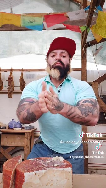 Traditional Cheese Cutting in a Rustic Workshop