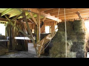 Using the ingenious Kunz hay lifter to put bales in the loft.