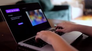 Typing AI Text to Image Prompt on Laptop