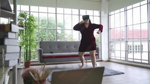 Asian fat woman in Virtual Reality or VR goggle wearable exercise fitness at home, New normal personalize technology simulation concept