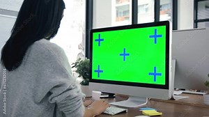 Workspace, green screen and people on computer, tracking markers and mockup for editing or copywriting on website. Creative agency, office and woman typing on desktop pc with online advertising space