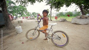 cambodian kids in slums near phnom penh city dumping area