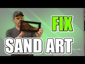 fixing a moving sand art sculpture that lost water