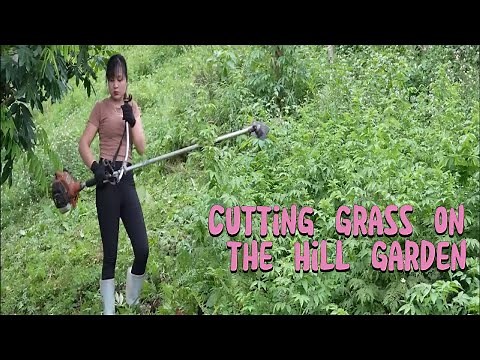 Beautiful Woman Using A Grass Cutter To Maintain Her Hillside Garden | Peaceful Life Near The Forest