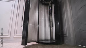 Inside a vertical solarium. Smooth camera zoom. Beauty salon concept. Russia, Rostov-on-Don 5july2022