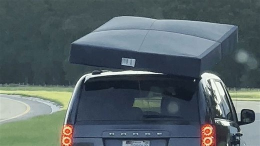 Dancing mattress delights motorists following car along roadway