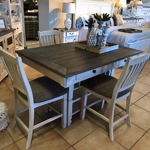 229K views · 251 reactions | From our showroom to your dining room. Check out the Bolanburg table, available in various heights to fit any home. | Ashley | Facebook