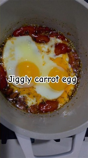 Very buttery egg with carrot and tomato. Quite satisfying to observe as it cooks