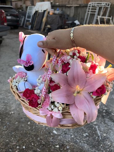 Snoopy Surrounded by Beautiful Pink Lilies