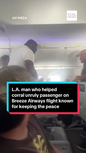 A Breeze Airways flight was diverted last week after an unruly passenger, who airline officials said was drunk and shouting obscenities, caused a scene and prevented them from landing at LAX. Now, Los Angeles middle school security guard Rayshaun Riley, who helped keep the passenger contained as the flight was diverted to Grand Junction Airport in Colorado, is being recognized for his history of keeping the peace. Video of the incident has since gone viral, showing the good Samaritan stepping up