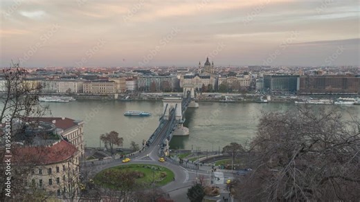 Budapest Hungary time lapse day to night city skyline at Danube River with Chain Bridge and St. Stephen's Basilica
