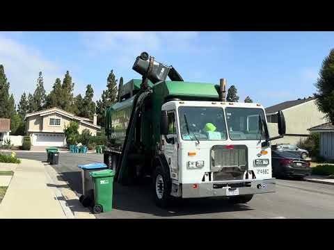 WM Irvine 2014 Peterbilt 320 Amrep Moving Through Trash