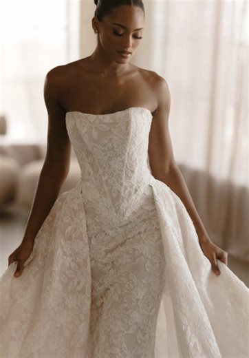 Lace lovers, say hello to this @Martina Liana Bridal stunner 🤍 From the designer: Romantic, sophisticated and undeniably couture, Style 1986 is a strapless fit-and-flare bridal gown crafted in layers of lace and tulle. The straight-across neckline introduces a structured, fully lined bodice adorned with intricate corded lace, offering timeless elegance. From the subtle basque waistline, the gown highlights the figure in a striking sculpted fit-and-flare silhouette. For brides craving extra impa