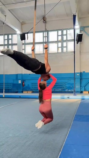 A couple takes calisthenics to a whole new level! 💪❤️ Watch as he holds a perfect back lever while she hangs suspended only by a kiss — pure strength, trust, and crazy body control. This is the level of connection and fitness goals many dream of! 🔥 Would you try this with your partner? 👀💯 #Calisthenics #CoupleGoals #Strength #FitnessShorts #BackLever #InsaneSkills #CrazyStunts | Pascal Fitness