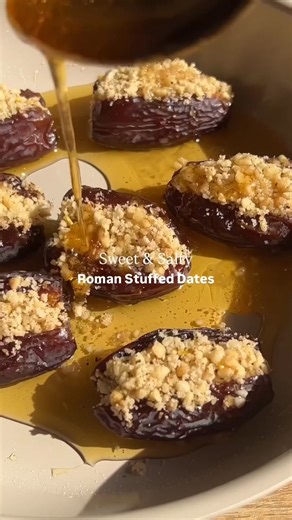 Roman Stuffed Dates 💫⁠ ⁠ Craving something sweet, salty, and a little unexpected?⁠ These honey-soaked stuffed dates are the ultimate flavor bomb - with crushed fresh walnuts, a kick of black pepper, and a warm honey drizzle 🍯🤎⁠ ⁠ You’ll need:⁠ 3 tbsp walnuts⁠ 3 tbsp pine nuts⁠ 1/3 tsp ground black pepper⁠ Pinch of salt⁠ 7 Medjool dates, pitted and halved⁠ 2 tbsp honey⁠ ⁠ To make:⁠ 1. Crush walnuts and pine nuts in a mortar and pestle until fine. Stir in black pepper and salt.⁠ 2. Gently open 