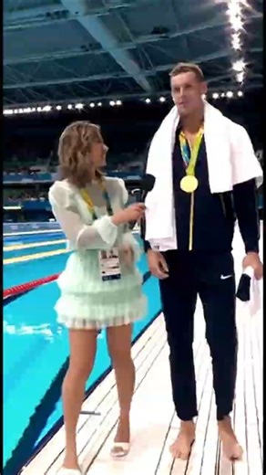How a Reporter Pushes a Swimming Gold Medalist into the Pool #Shorts #Viral #Sports