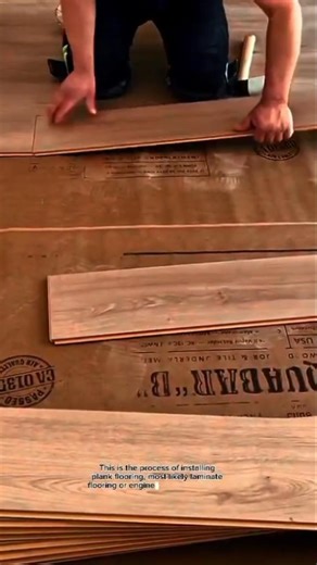 Professional Laminate Flooring Installation Using Rubber Mallet Click-Lock Floating Floor Technique