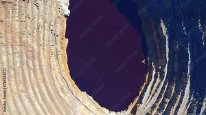 Aerial drone view of Corta Atalaya with mining levels at open mine pit. Deep excavation of pyrite and extraction of minerals of copper and gold in Minas de Riotinto, Huelva, Andalusia, Spain