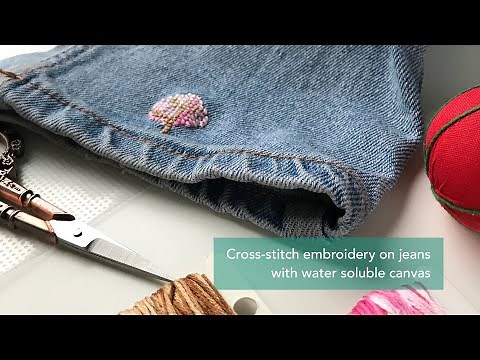 Cross stitch embroidery on jeans with water soluble canvas