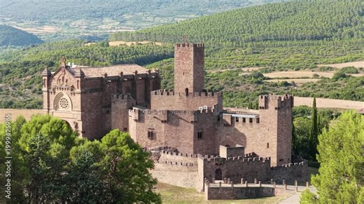 Majestic aerial view of the historic javier castle and basilica. This medieval fortress is a prominent landmark in the navarre region of spain