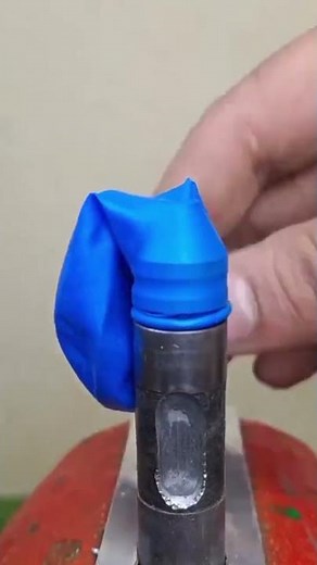 the process of installing a tip seal on a long iron using a balloon.