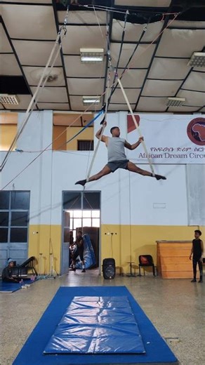Aerial Acrobat Performing Trapeze Stunts at African Dream Circus