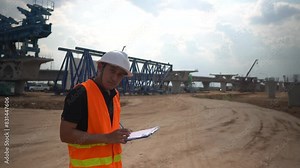 Engineering team discussing motorway and large overpass construction, troubleshooting issues, and planning to complete the project within the set timeframe.