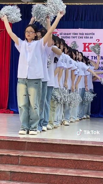 Cheerleading Performance on Stage by Students