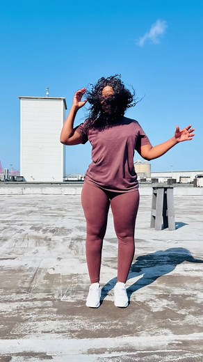 Dynamic Rooftop Dance Performance with Clear Sky