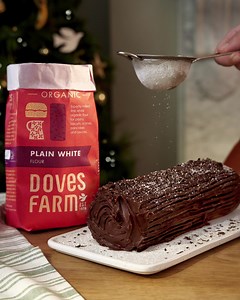 This traditional, festive Yule Log has a chocolate sponge, with chocolate filling and a chocolate topping. Topped with a dusting of icing sugar, it is a showstopper that never fails to impress. Use our Organic Plain White Flour for a deliciously light swiss roll sponge. Find the recipe here: https://www.dovesfarm.co.uk/recipes/chocolate-yule-log | Doves Farm