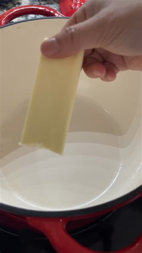 Tam’s sausage and rice stuffing recipe 1 bag of Pepperidge farm herb stuffing recipe 1 package of Jimmy Dean sausage, sage or regular flavor 3 stalks of celery, chopped 1 onion, chopped 3 carrots, chopped small 1/2 bell pepper, chopped 2 eggs, beaten 2 tablespoons of dried sage 1 teaspoons of Poultry seasonings 1 teaspoon of chicken bouillon powder 1 teaspoon of sugar 1/2 teaspoon of pepper 1 large container of chicken broth 2 cups of cooked white rice 1/2 stick of butter, divided Preheat your o