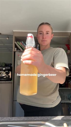 Holly van Dam | Grown by Holly on Instagram: "Can’t help but jump at every POP Never have I ever had so many messages over one singular recipe after popping a bottle open on my stories! 2L of Ginger beer: - 1/3 cup grated ginger (skin on, bad bits cut off) - 2 lemon juice - 3/4 cup sugar or honey - 2L water - 1/2 cup active ginger bug - Simmer everything (apart from ginger bug) in a pot for 10 mins - let cool & add ginger bug - pour into sterilised bottles (with pop caps) - put in cupboard & bur