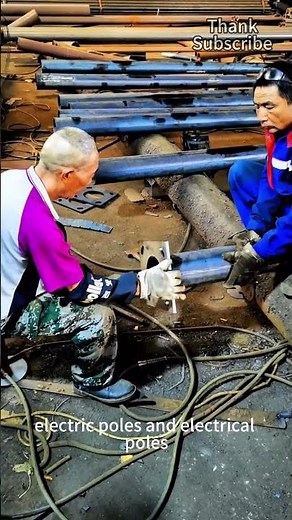 Workers skillfully install the chassis of street light poles