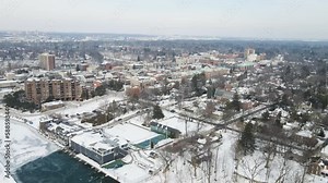 Flying over a frozen river to the downtown lakeshore suburb in Oakville.