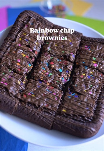 If you love a rich chocolate brownie with that colorful crunch on top, this one’s for you. Save this recipe for your next baking day 🤍 Ingredients: • 3/4 cup unsalted butter, melted • 1 1/4 cup packed light brown sugar • 2 eggs • 1 teaspoon vanilla extract • 1/2 cup cocoa powder • 1/2 cup all purpose flour • 1/2 teaspoon salt • 1/2 cup rainbow chocolate chips Instructions: 1. Preheat your oven to 325°F and line an 8x8 baking pan with parchment paper. 2. In a bowl, whisk together the melted butt