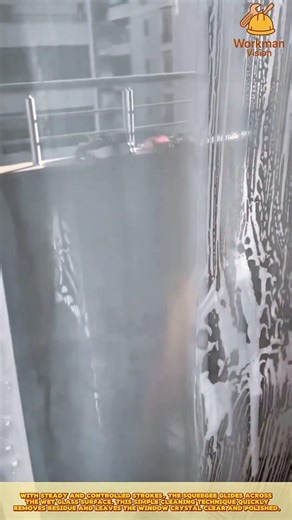 Skilled Worker Using Window Squeegee for Streak Free Glass Cleaning