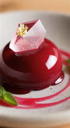 Difficulty ⭐⭐⭐⭐ (ADVANCED) ⏰ Cooking time : 45 min. 🍽️ Category : Dessert 🛒 Ingredients: For the crystal-clear dome shell: • 2 cups clear white grape or lychee juice, fully strained • 1/3 cup sugar • 1 tablespoon lemon juice • 1 1/2 teaspoons agar-agar powder • 1 tablespoon glucose syrup or light corn syrup For the ruby flare core: • 1 cup clear pomegranate raspberry juice blend, fully strained • 2 tablespoons sugar • 1 teaspoon agar-agar powder • Optional natural food coloring (ruby red / cri