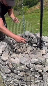 the process of making a campfire from stacked rocks